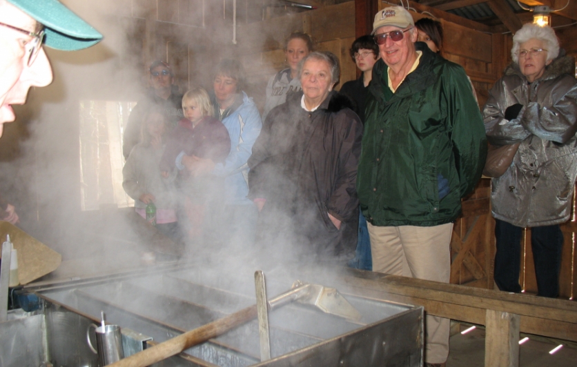 Participants watch syrup being made.