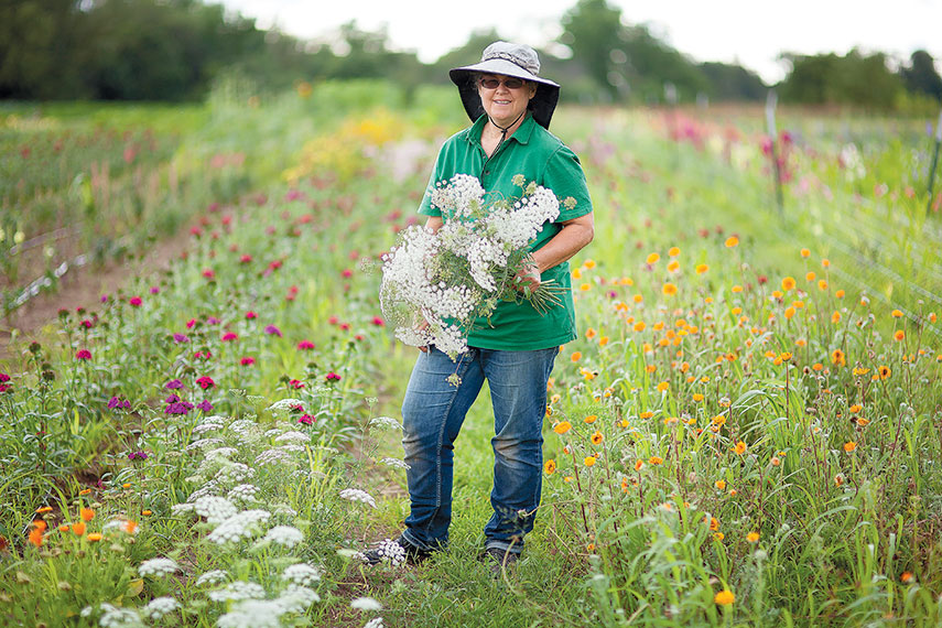 Jo Beachy stands in the field