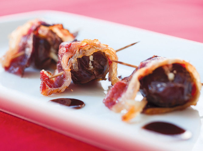 Dates stuffed with goat cheese wrapped in beef bacon.