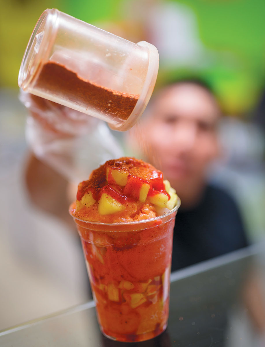 A Mango Shaved Ice topped off with spicy syrup and chile powder